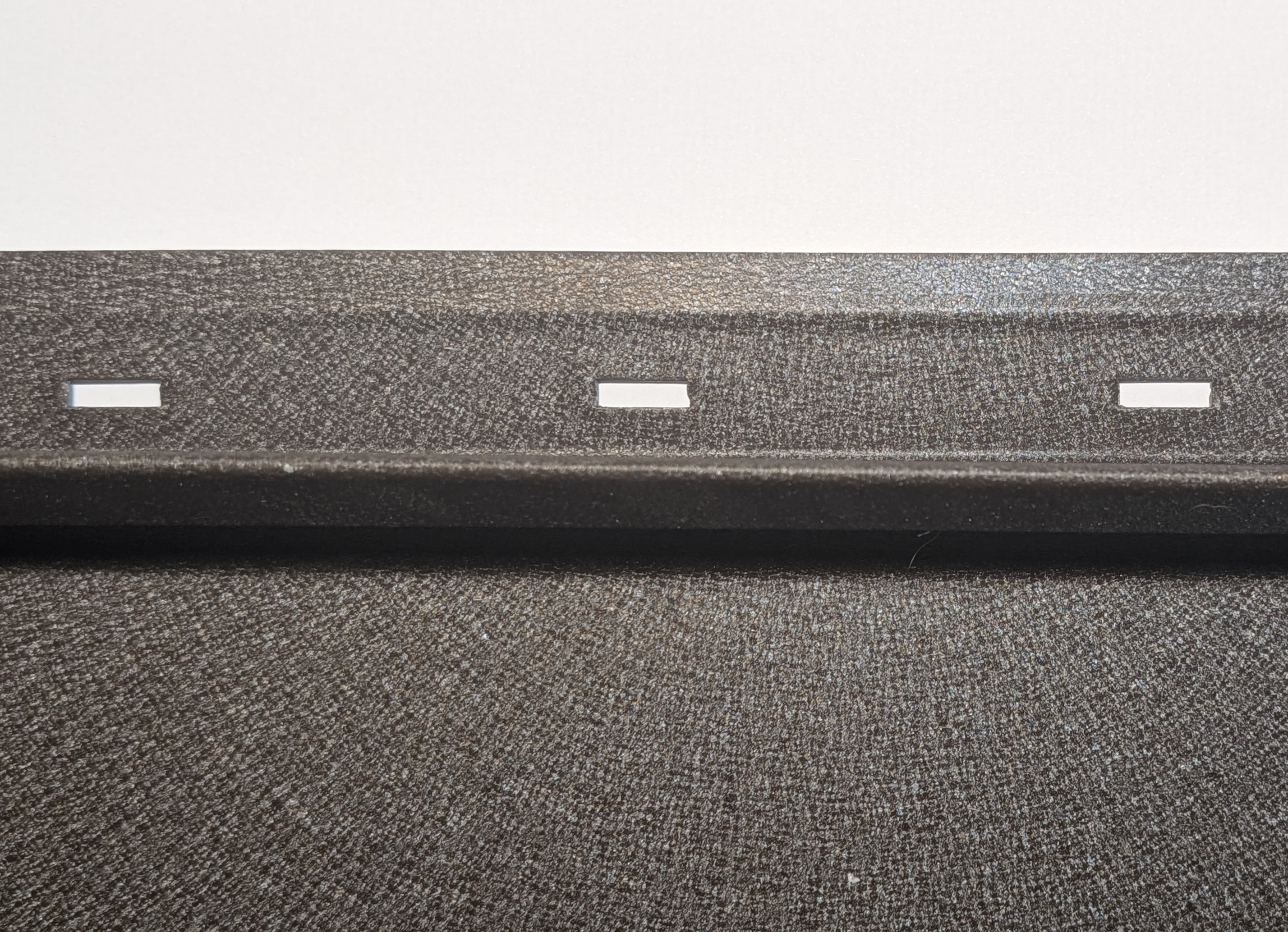 Snap Lock SL-15/SL-16 — perforated expansion slots at 2-inch centres in a concealed recessed channel. Pancake-head fasteners sit inside the channel, completely hidden from view.